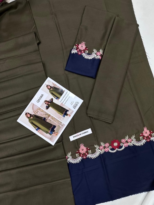 QASWA is a renowned name in women’s fashion, known for its commitment to quality, design innovation, and attention to detail. The brand often blends traditional craftsmanship with contemporary aesthetics. With the QS‑653 suit, QASWA demonstrates its mastery in winter fashion, weaving together traditional dhanak fabric and modern embossing techniques to create a piece that’s both luxurious and functional.