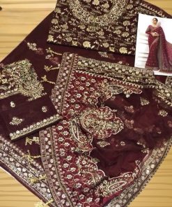 The pallu features heavy embroidery, enhanced with stone hand work and delicate hanging embellishments. These hanging details add movement and drama, creating a stunning visual effect as you walk.