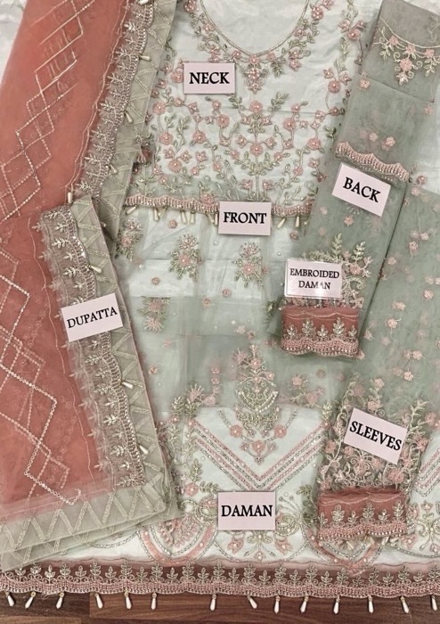 The Emaan Adeel EA-704 Luxury Net Suit is a stunning 6 kali frock design crafted for women who love heavy embroidered formal wear. Made with premium net fabric, this outfit features spangle work, intricate handwork, and fancy lace detailing, making it perfect for weddings and festive occasions.