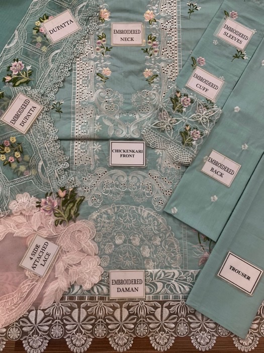 With its heavy embroidered chickenkari cotton shirt, elegant organza dupatta, and classic cotton trouser, this outfit is ideal for both festive and semi-formal occasions.