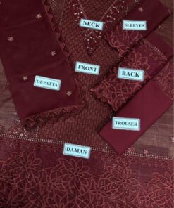 The design architecture of the Crimson CR-989 Chickenkari suit is truly a work of art. The spotlight belongs to the front full heavy Chickenkari embroidered canvas, offering a rich, textured look that exudes royalty. It is elevated by an intricately embroidered and handwork neck patch, adding a bespoke touch of glamour.