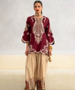 Stunning red heavy embroidered pure velvet two-piece Pakistani festive suit paired with a digital printed silk trouser.